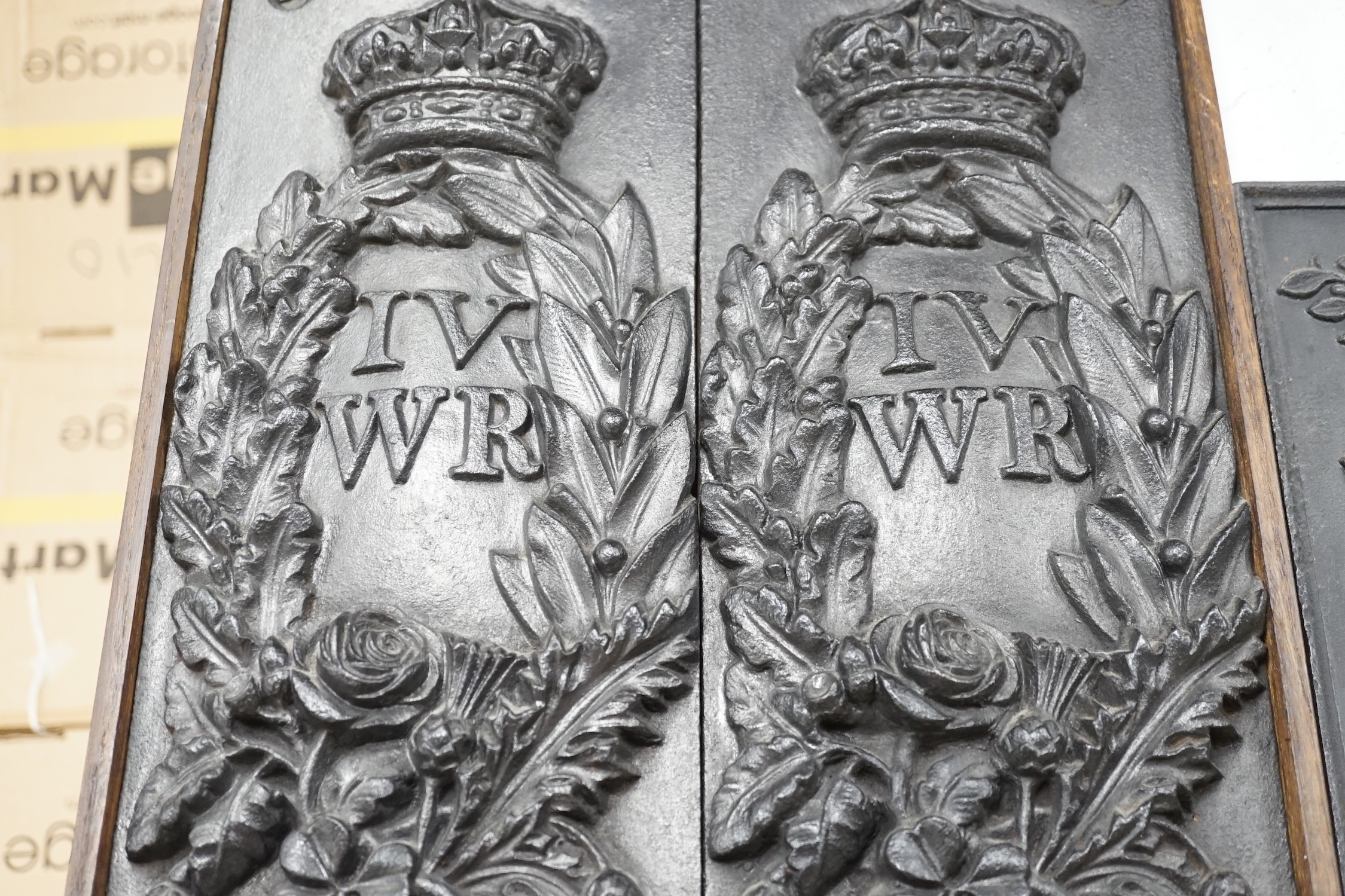 A pair of William IV Board of Ordinance cast iron framed plaques and a smaller plaque, each 54cms high x 17cms wide